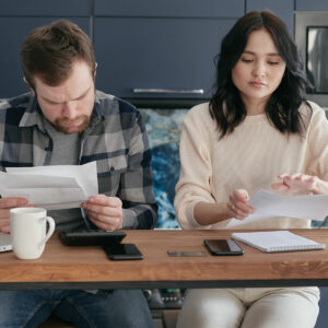 Couple reading bills